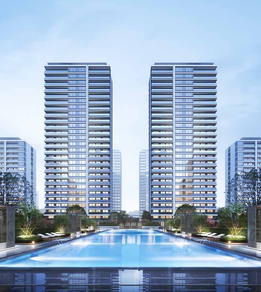 Twin glass residential towers above a resort pool
