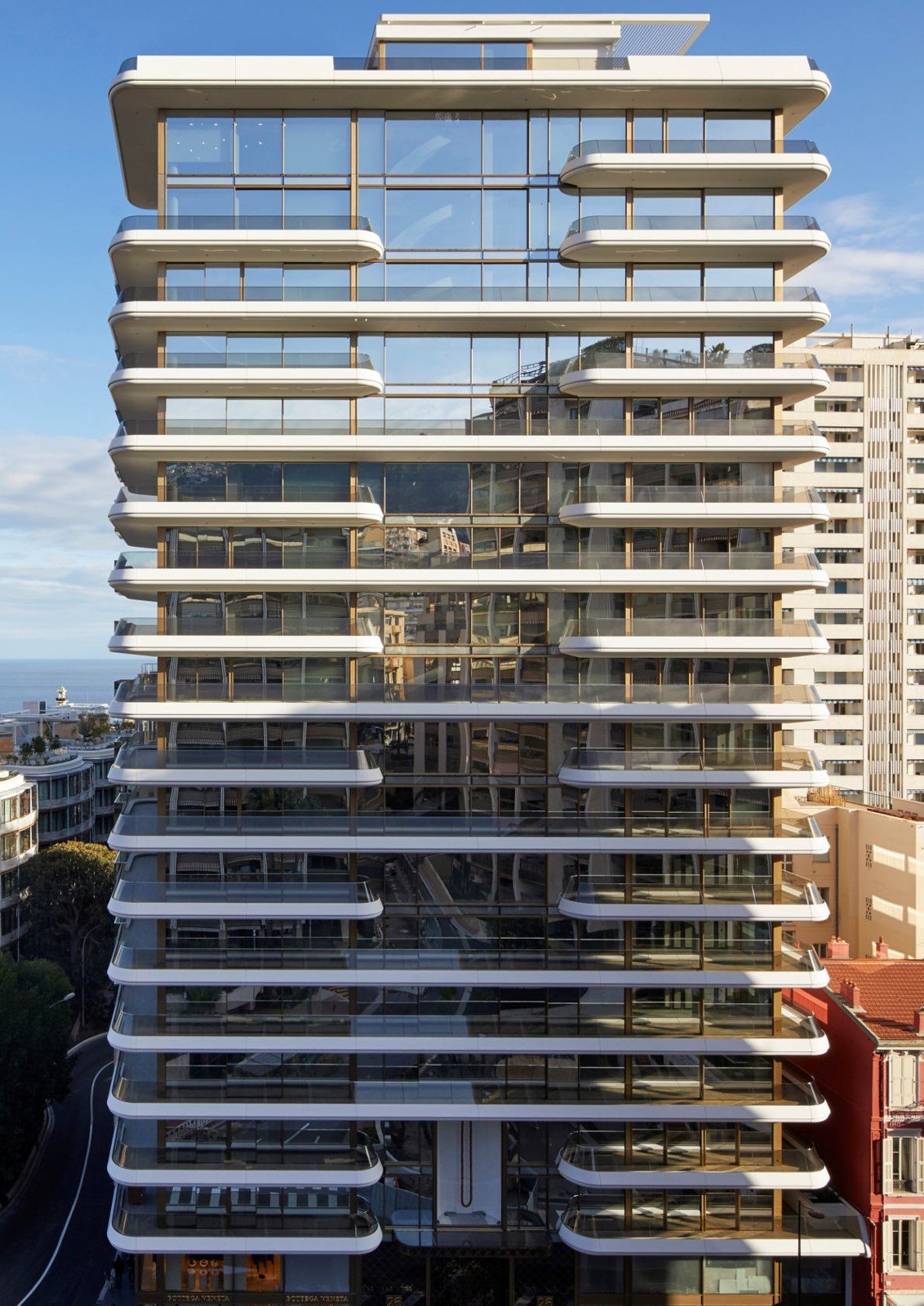Residential tower with wraparound glass balconies