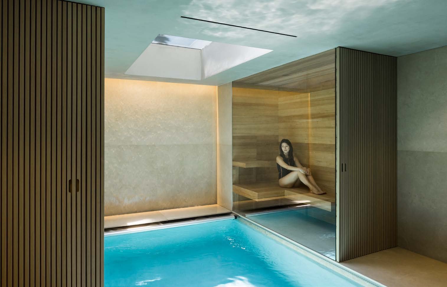 Indoor pool behind a glass wall