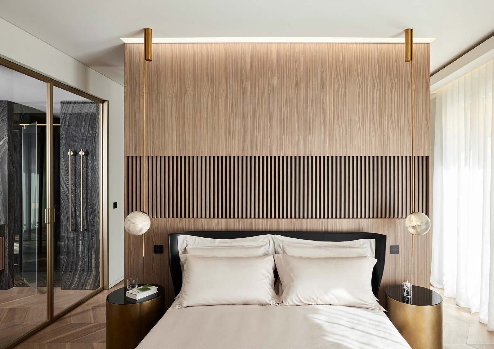 Bedroom with glass doors to a walk-in wardrobe