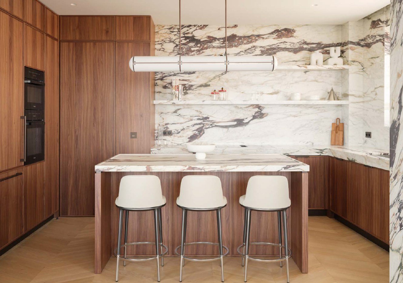 Walnut kitchen with a marble wall and island
