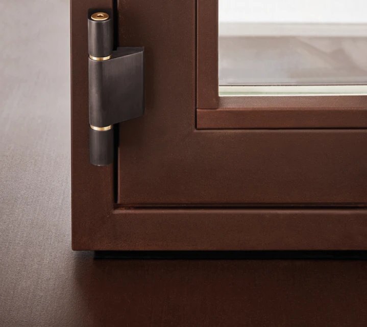 Bronze barrel hinge on a copper-brown frame