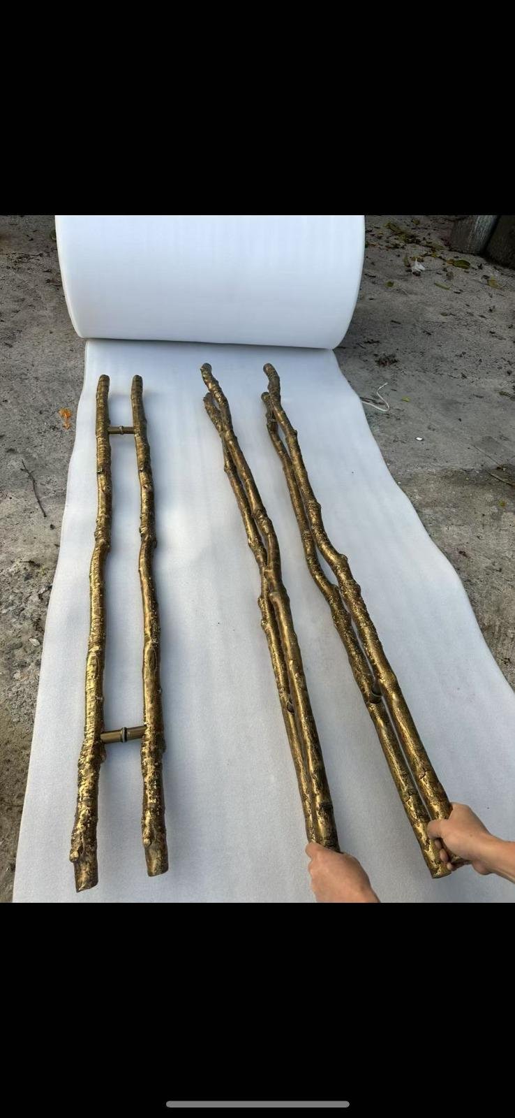 Gilded cast-bronze branch pulls ready for packing