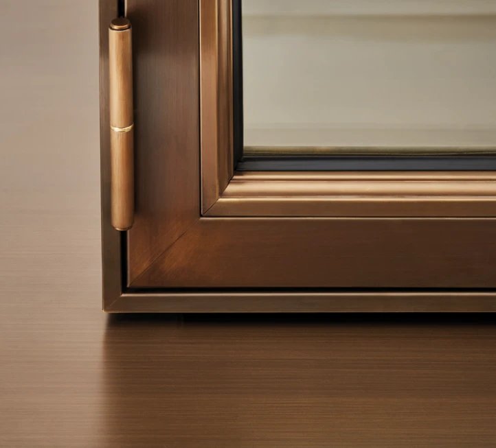 Brass barrel hinge on a bronze frame