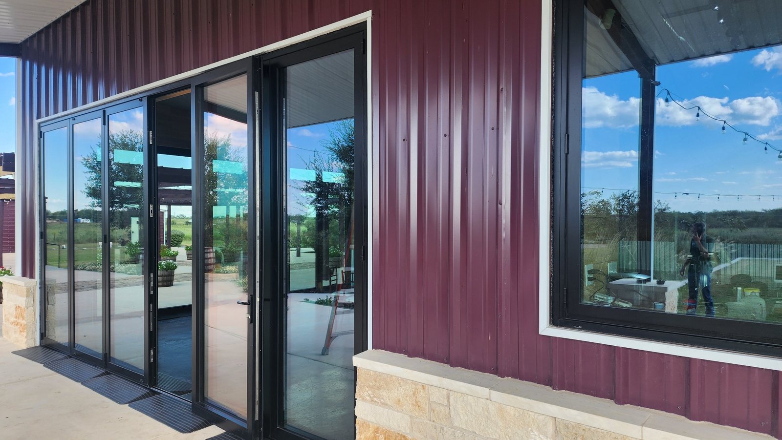 Bifold doors and a casement window on a steel event barn