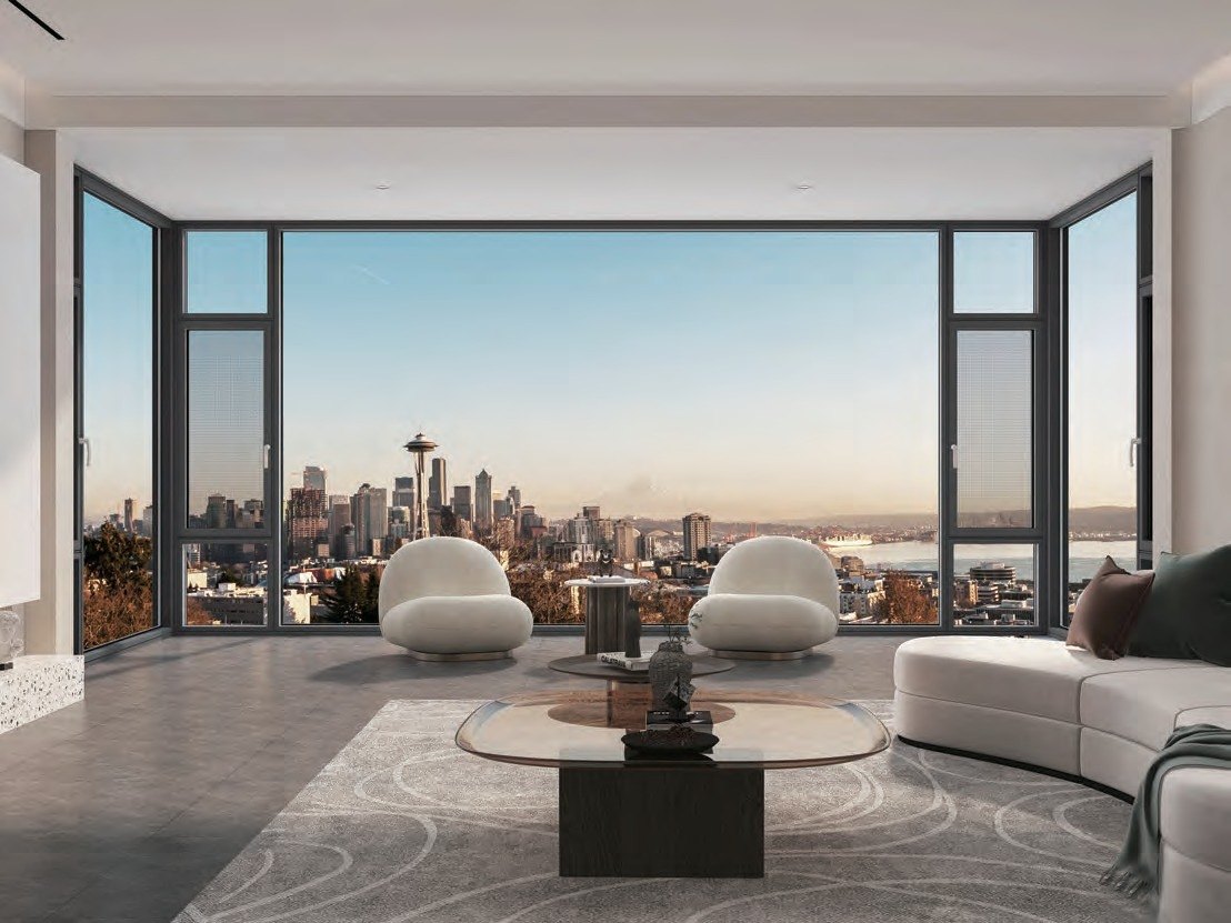 Corner window wall framing a city skyline