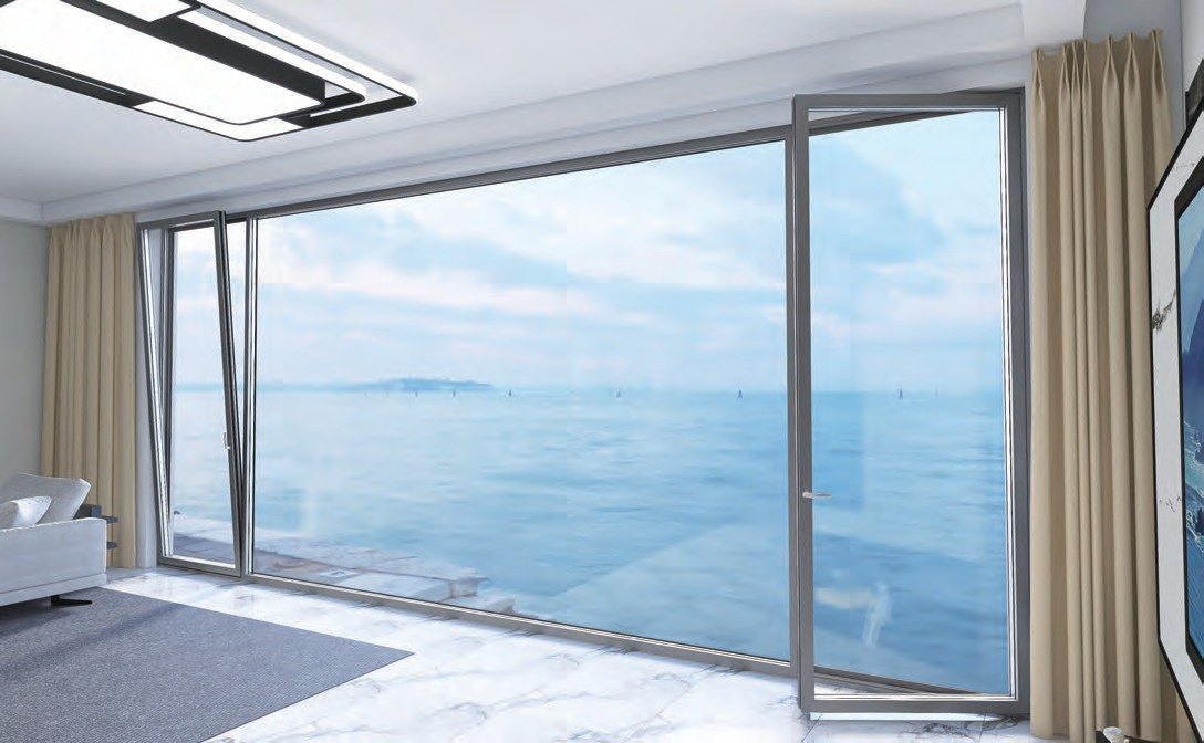 Floor-to-ceiling window with a tilt-and-turn sash over the sea