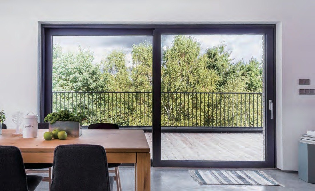 Black lift-and-slide door onto a balcony
