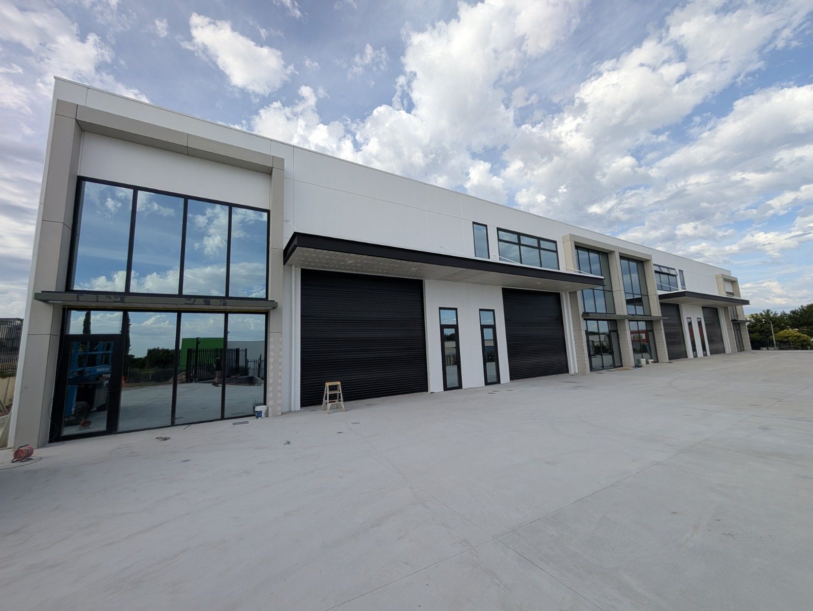 Two-storey storefront and window wall on new industrial units