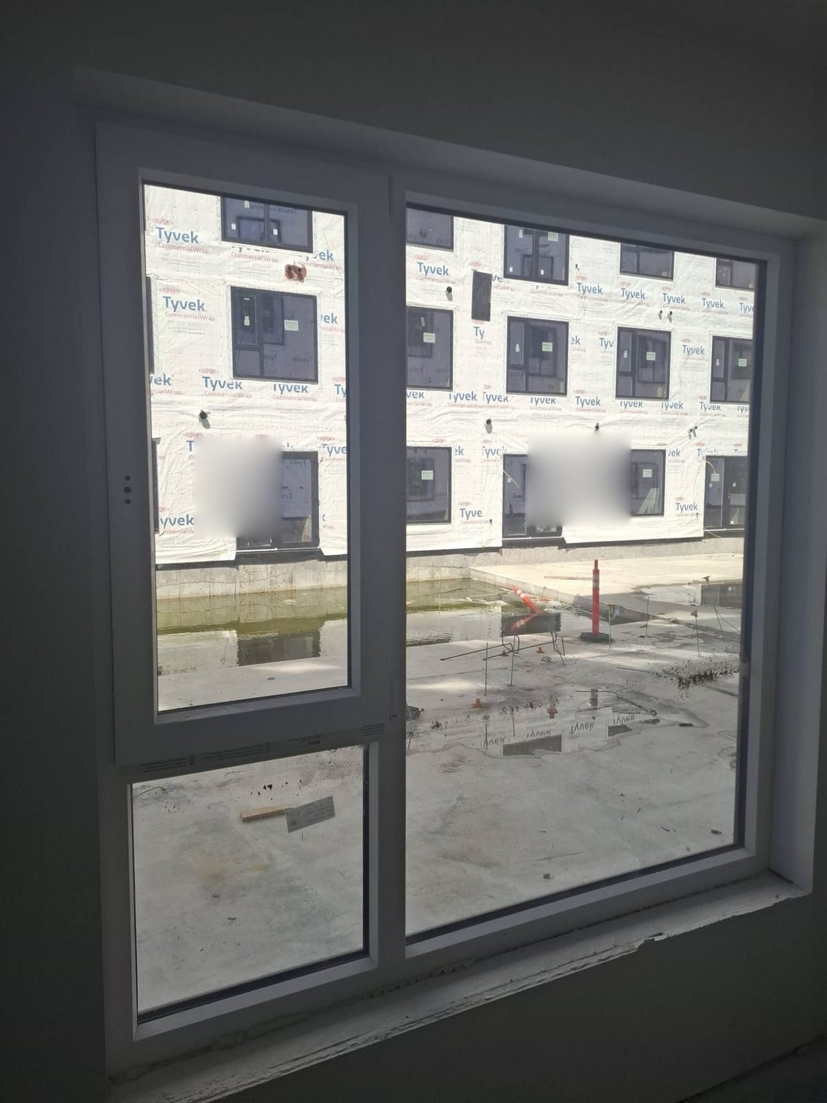 Tilt-and-turn window with a fixed lite, seen from inside a new apartment