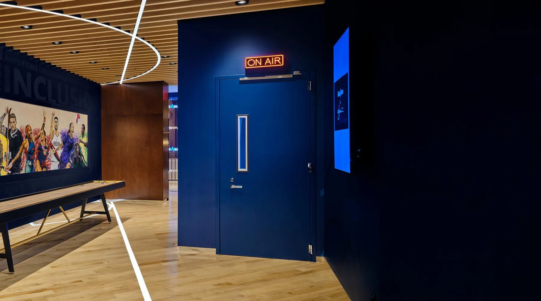 Navy acoustic door into a podcast studio