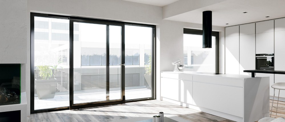 Black PSK tilt-and-slide patio door beside an open kitchen