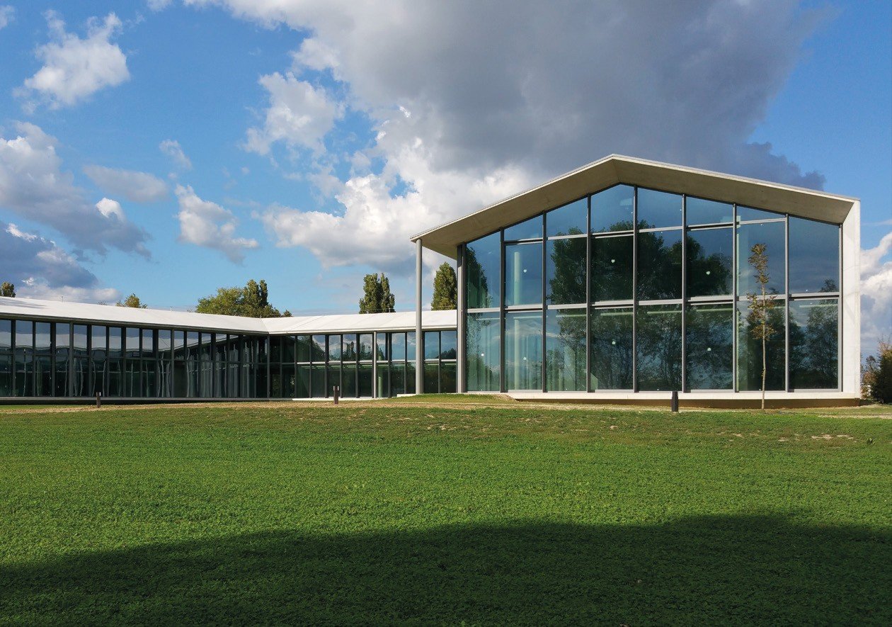Glass pavilion with a steel-framed gable