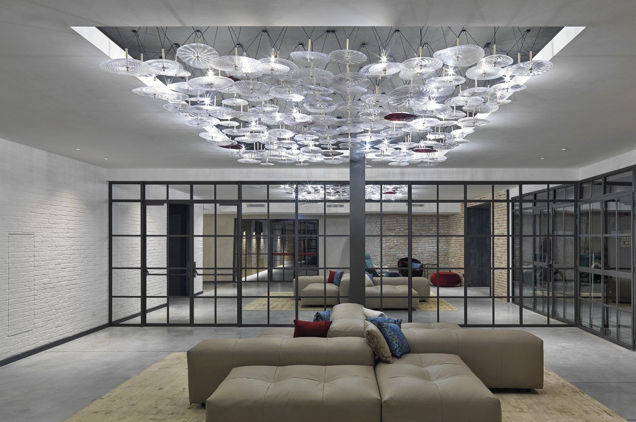 Steel-and-glass partition wall around a lounge